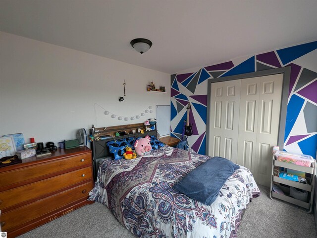 bedroom with a closet and carpet