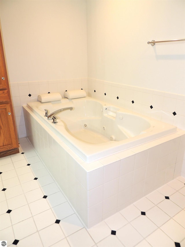 bathroom featuring tile patterned floors and a whirlpool tub
