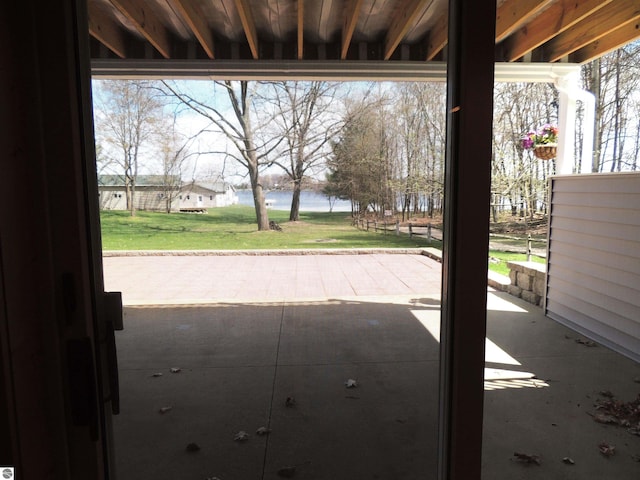 doorway to outside with a water view