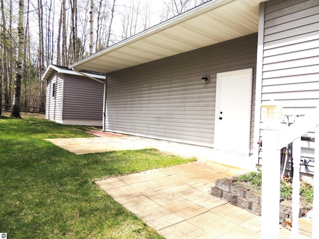 view of exterior entry featuring a yard