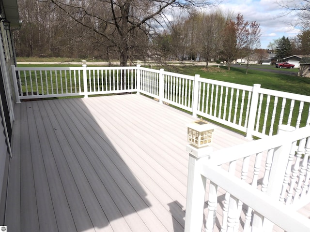 wooden terrace with a lawn