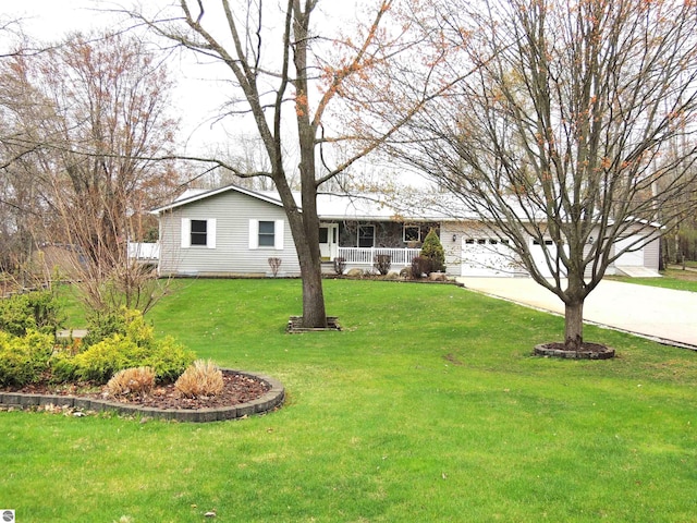 single story home featuring a porch, a garage, driveway, and a front lawn