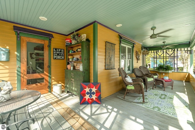 deck with a porch and ceiling fan