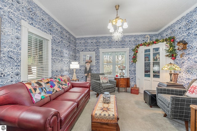 carpeted living room featuring an inviting chandelier, ornamental molding, plenty of natural light, and wallpapered walls