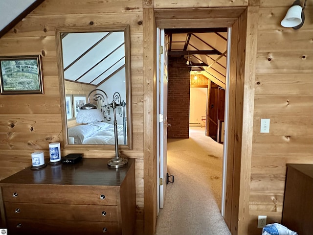 corridor with carpet floors and wood walls