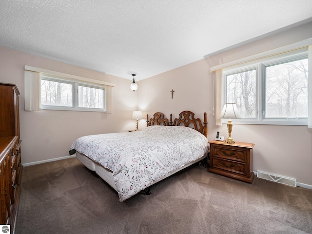 bedroom featuring visible vents, carpet flooring, and baseboards