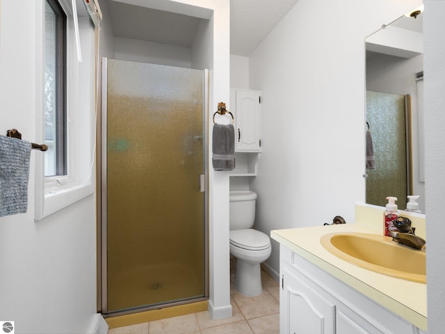 full bathroom with tile patterned flooring, a shower stall, vanity, baseboards, and toilet