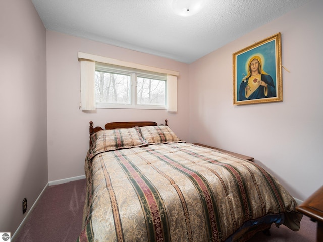 bedroom featuring carpet flooring and baseboards