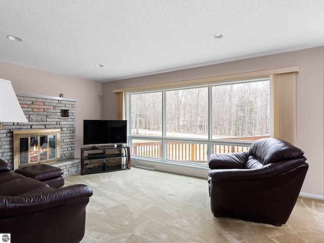 carpeted living area featuring recessed lighting, a textured ceiling, and a brick fireplace
