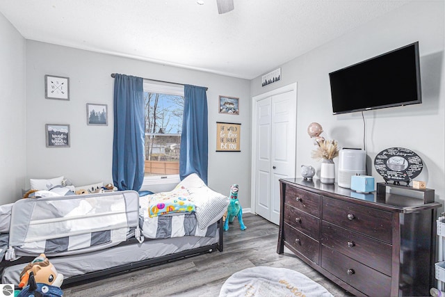 bedroom with a closet and wood finished floors