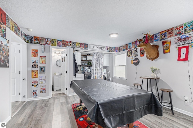 rec room featuring baseboards, a textured ceiling, wood finished floors, and pool table