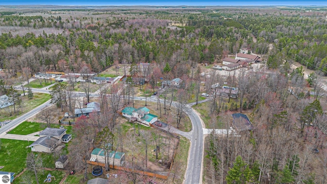 birds eye view of property with a residential view and a view of trees