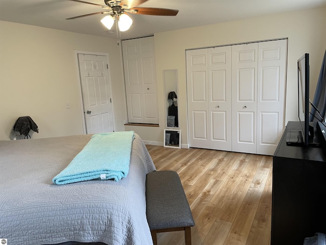 bedroom with light wood-style floors, ceiling fan, and a closet