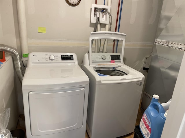 laundry room with washer and dryer and laundry area