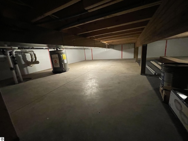unfinished basement with electric water heater