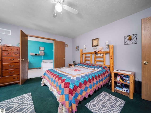 carpeted bedroom featuring visible vents, a ceiling fan, a textured ceiling, and connected bathroom