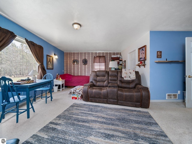 living area with carpet flooring, baseboards, and visible vents