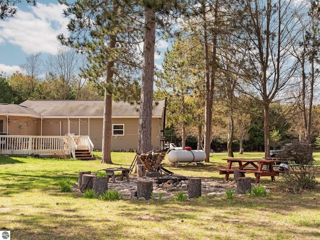 view of yard featuring a wooden deck