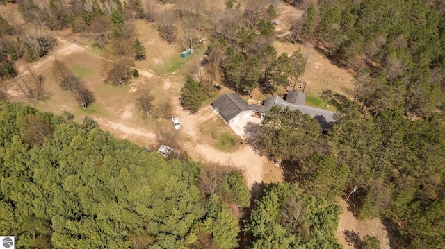 drone / aerial view featuring a forest view