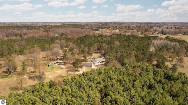 drone / aerial view featuring a forest view