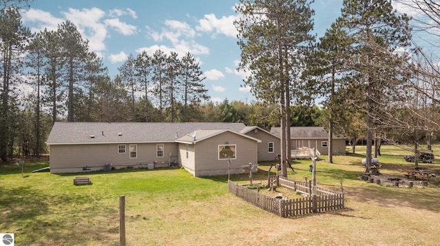 back of property with a yard
