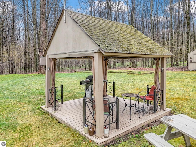 deck with a gazebo and a yard