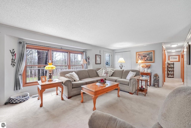 living room featuring a textured ceiling, light colored carpet, and visible vents