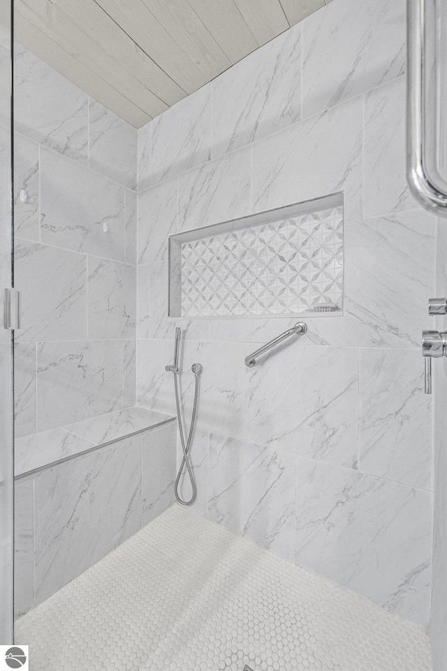 full bathroom with tiled shower