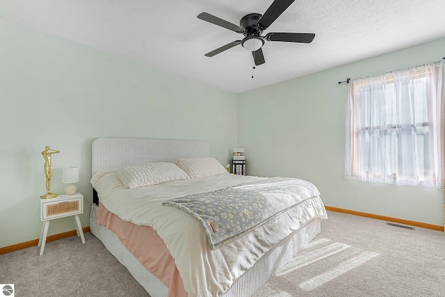 7276 Tiger Dr Unit A, And B, Lake Ann, MI 49650 - carpeted bedroom with baseboards, a ceiling fan, and visible vents
