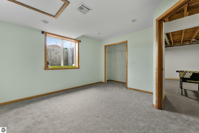 7276 Tiger Dr Unit A, And B, Lake Ann, MI 49650 - unfurnished bedroom featuring carpet floors, baseboards, and visible vents