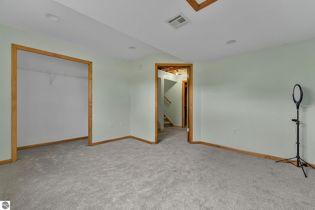 7276 Tiger Dr Unit A, And B, Lake Ann, MI 49650 - unfurnished bedroom with baseboards, carpet flooring, and visible vents