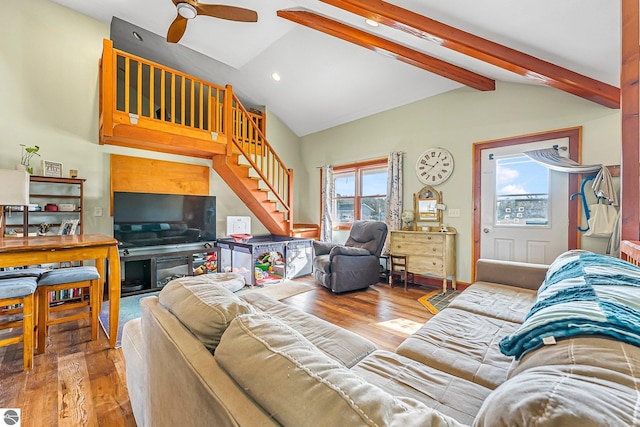 7276 Tiger Dr Unit A, And B, Lake Ann, MI 49650 - living area featuring ceiling fan, vaulted ceiling with beams, stairs, and wood finished floors