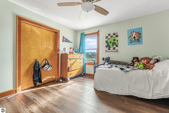 7276 Tiger Dr Unit A, And B, Lake Ann, MI 49650 - bedroom with baseboards, a ceiling fan, and wood finished floors