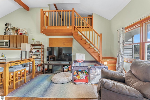 7276 Tiger Dr Unit A, And B, Lake Ann, MI 49650 - living room featuring vaulted ceiling with beams, stairway, and wood finished floors