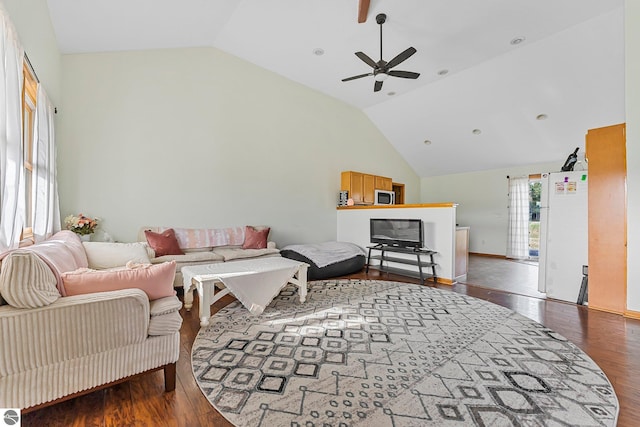7276 Tiger Dr Unit A, And B, Lake Ann, MI 49650 - living area with baseboards, a ceiling fan, vaulted ceiling, and wood finished floors