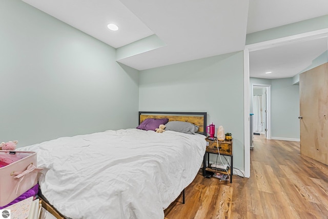7276 Tiger Dr Unit A, And B, Lake Ann, MI 49650 - bedroom with baseboards and wood finished floors