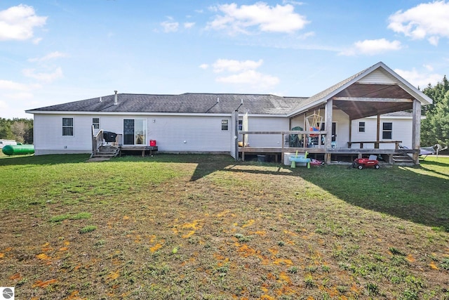7276 Tiger Dr Unit A, And B, Lake Ann, MI 49650 - rear view of property with a yard and a wooden deck