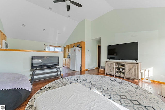 7276 Tiger Dr Unit A, And B, Lake Ann, MI 49650 - living room with visible vents, ceiling fan, dark wood-style floors, and high vaulted ceiling