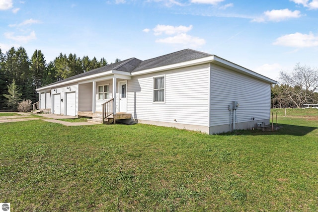7276 Tiger Dr Unit A, And B, Lake Ann, MI 49650 - view of front of property with concrete driveway, an attached garage, and a front yard