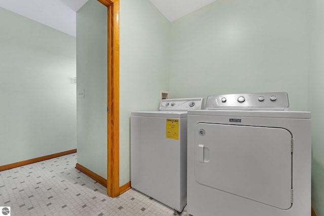 7276 Tiger Dr Unit A, And B, Lake Ann, MI 49650 - laundry area featuring washer and dryer, laundry area, baseboards, and light floors