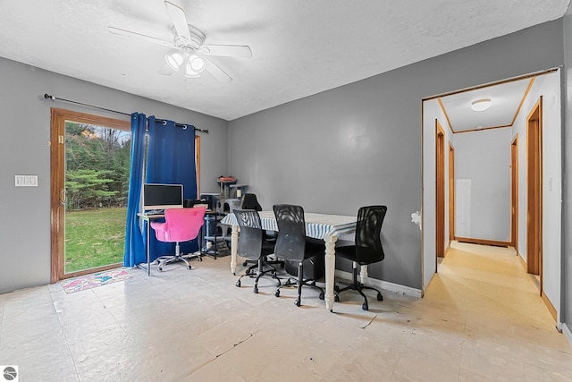 1981 S Lake Mitchell Dr, Cadillac, MI 49601 - home office with a ceiling fan and baseboards