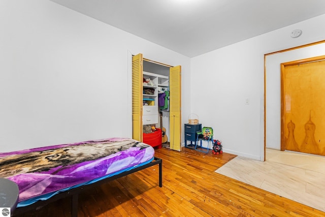 1981 S Lake Mitchell Dr, Cadillac, MI 49601 - bedroom with a closet and hardwood / wood-style flooring