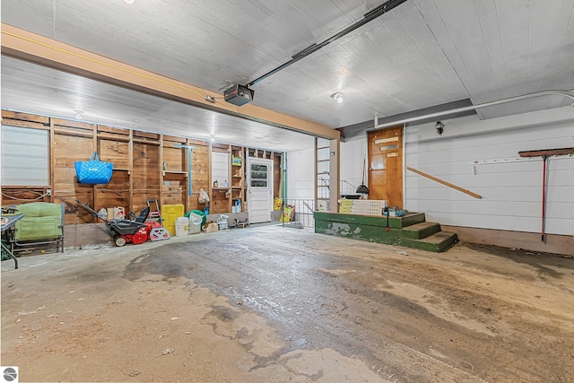 1981 S Lake Mitchell Dr, Cadillac, MI 49601 - garage featuring a garage door opener