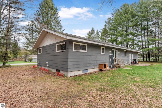 1981 S Lake Mitchell Dr, Cadillac, MI 49601 - exterior space featuring a yard and entry steps