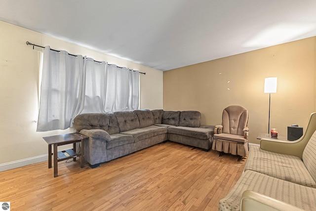 1981 S Lake Mitchell Dr, Cadillac, MI 49601 - living area featuring baseboards and light wood-style flooring