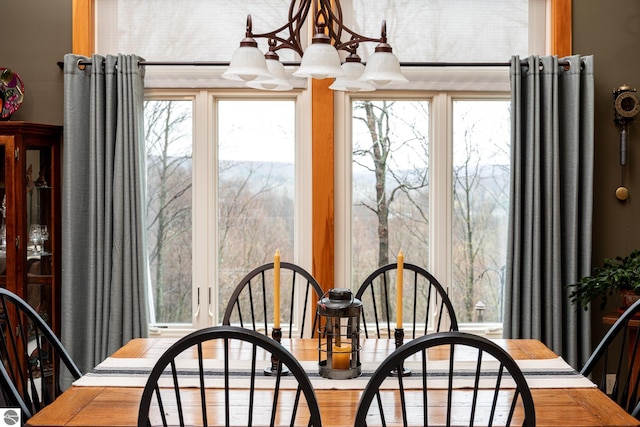 dining room with a notable chandelier and a healthy amount of sunlight
