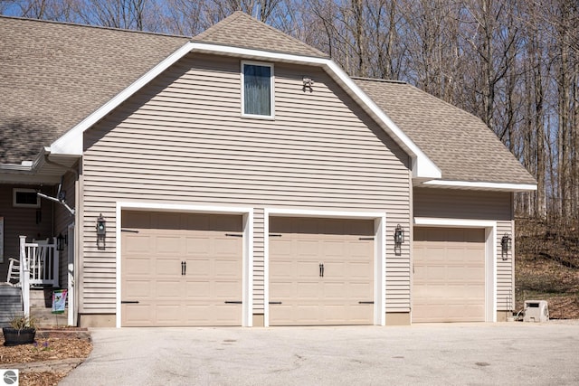garage featuring driveway