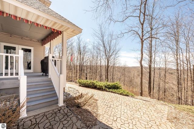 view of yard featuring covered porch