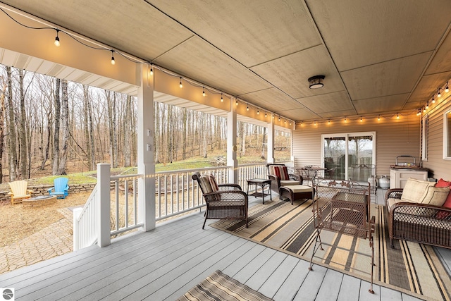 wooden terrace featuring an outdoor hangout area