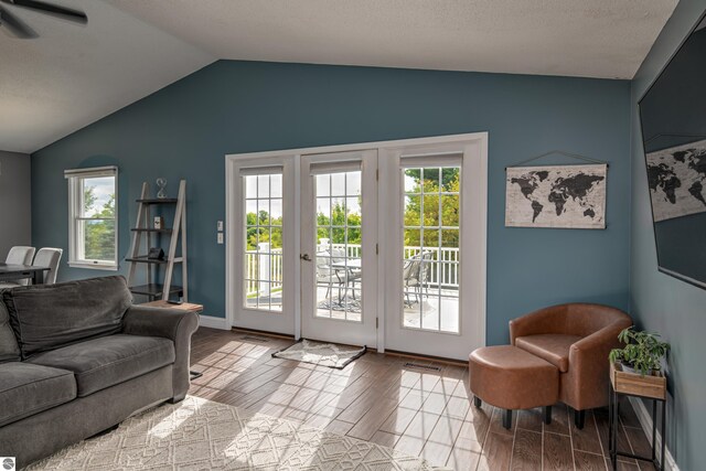 4215 Hearthside Dr, Traverse City, MI 49684 - interior space featuring plenty of natural light, vaulted ceiling, wood finished floors, and visible vents